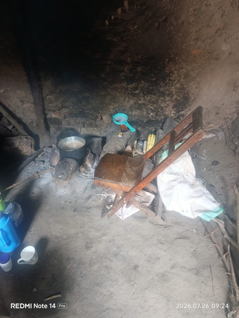 Open fireplace in rural kitchen